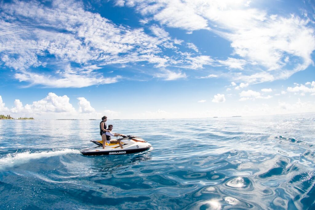 Two People Riding On Jet Ski